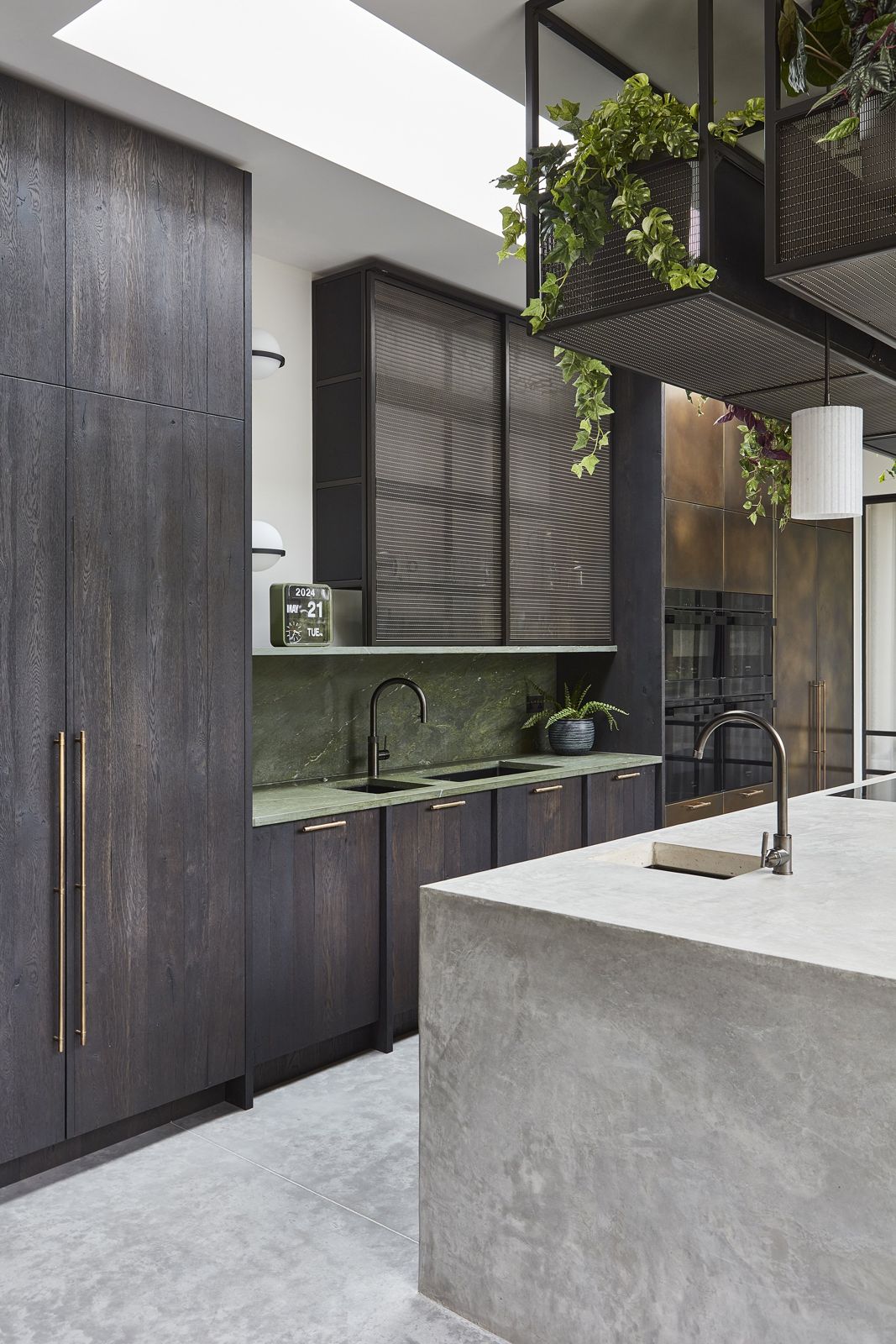 Polished concrete island under a run of hanging planting