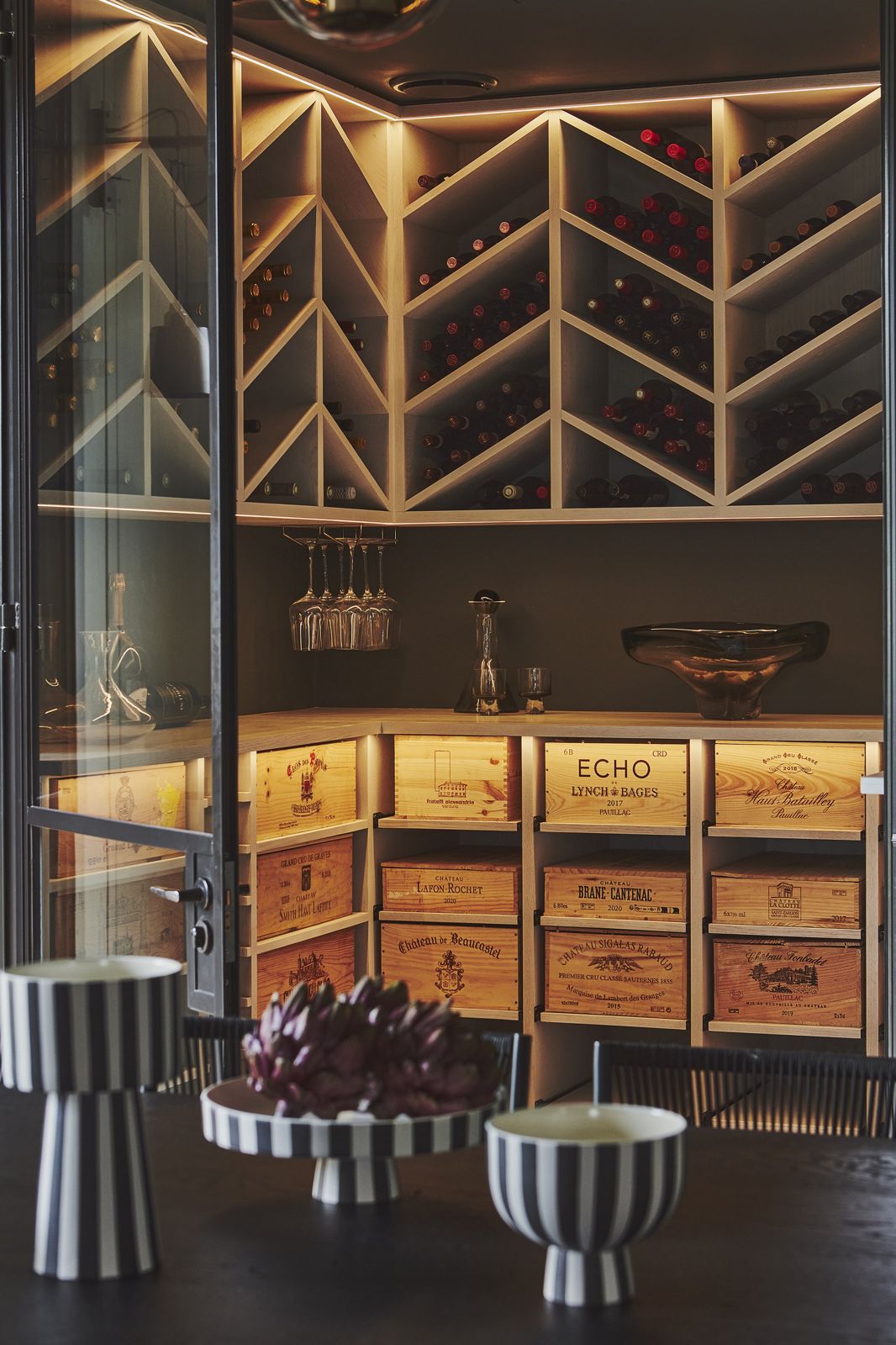 Handcrafted wine cellar with backlit racking