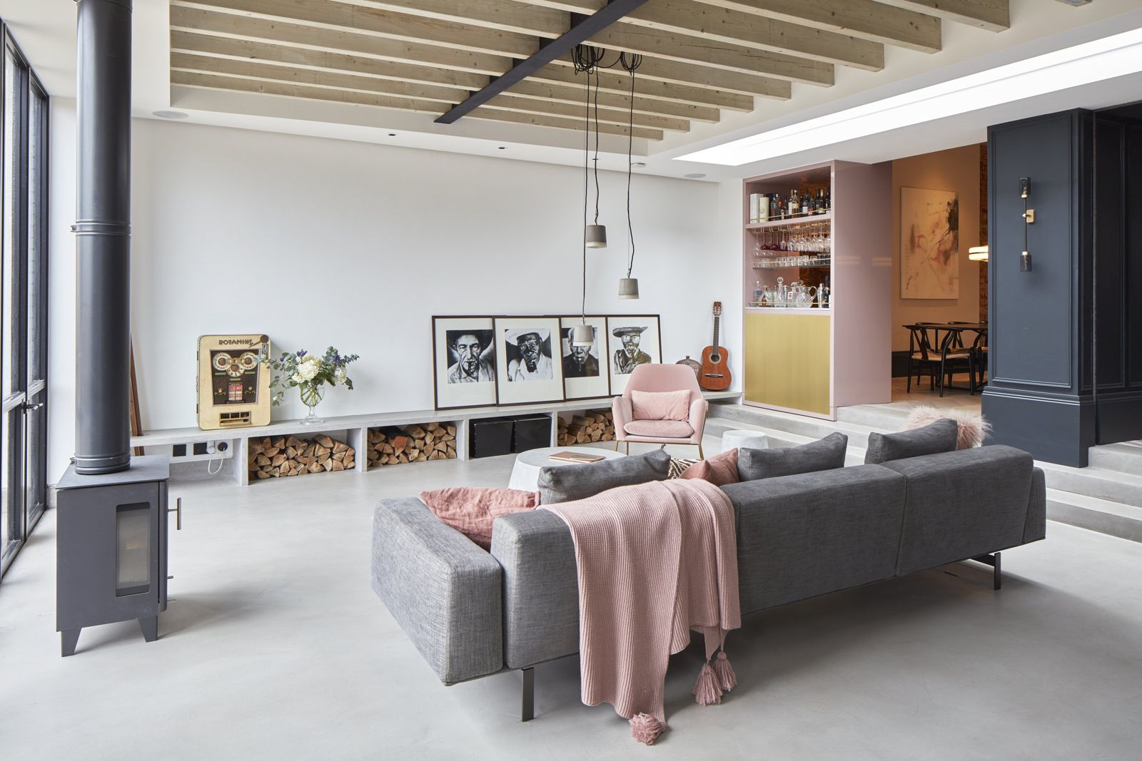 Living space with log burner and layered seating