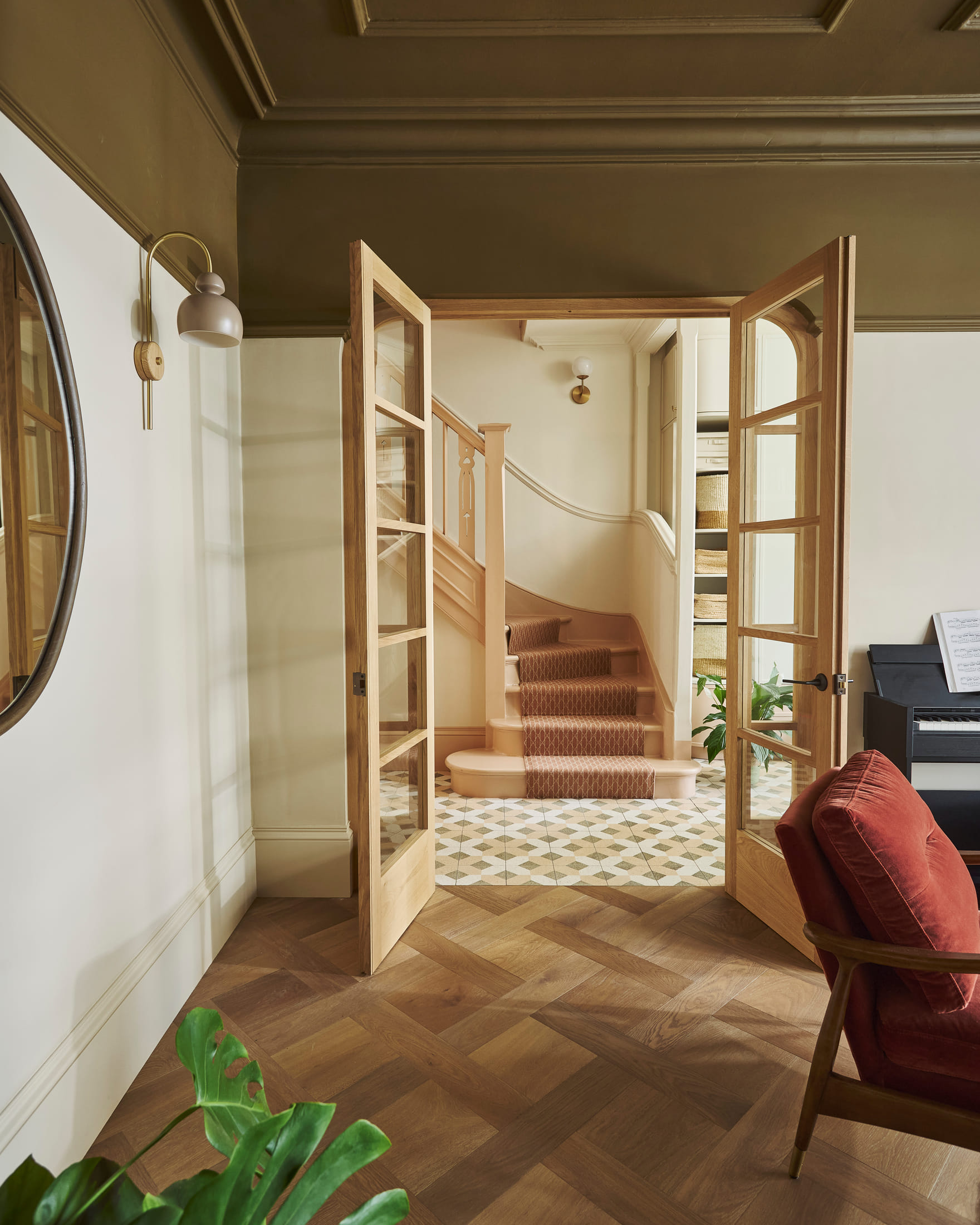 Arched glazed oak doors opening from the drawing room to the hall