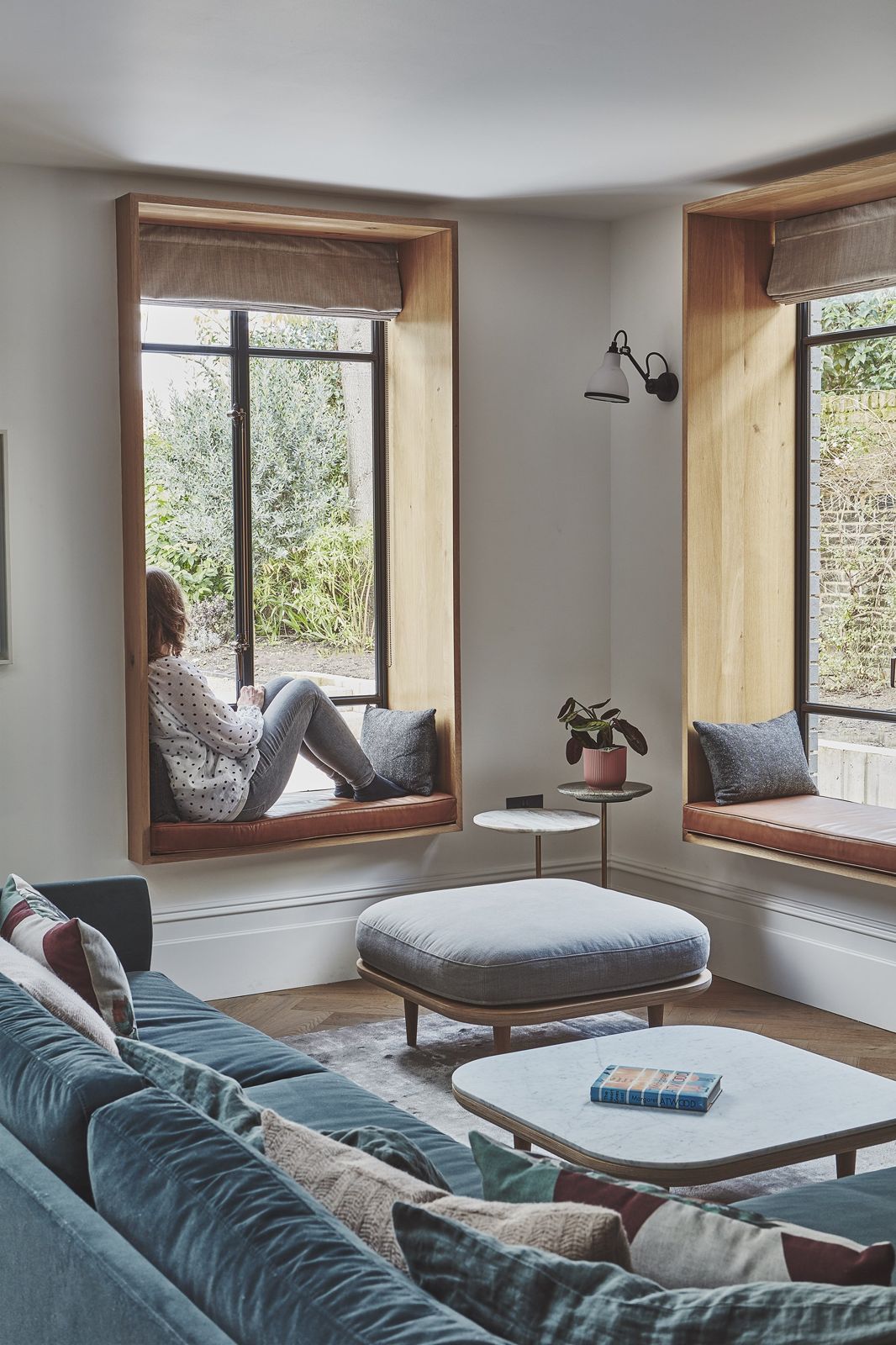 Sitting room with a deep window seat and pale wool furnishings