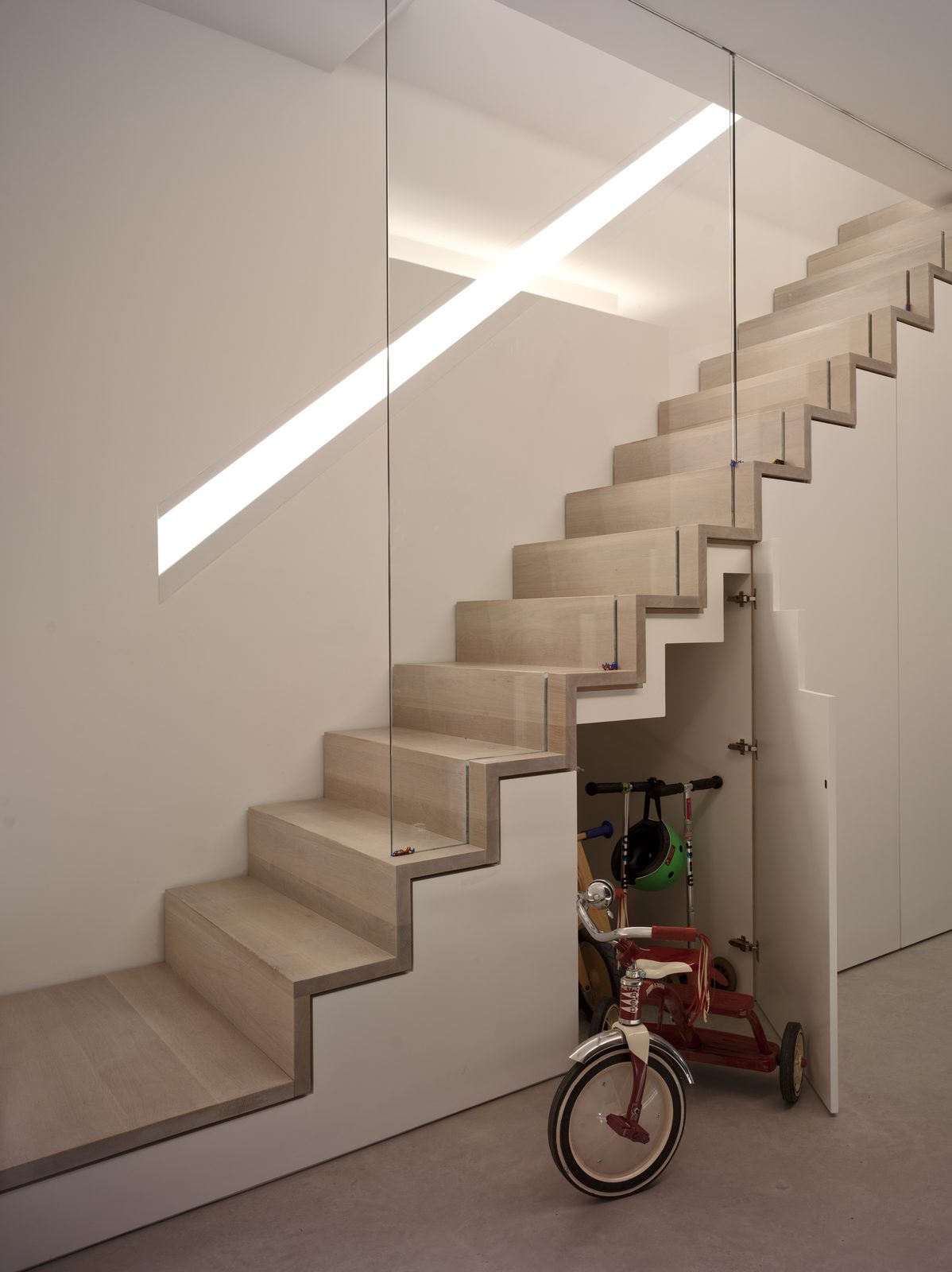 Basement stair with a store built beneath the treads